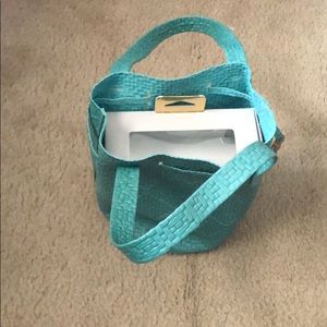 Woven teal bucket bag